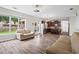 Open-concept living space features modern lighting, stainless steel appliances, and wood-look floors at 1786 Jameson Cir, Lawrenceville, GA 30043