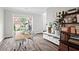 Well-lit office with large window, desk, shelving, and neutral paint, creating a functional workspace at 1786 Jameson Cir, Lawrenceville, GA 30043