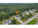 Aerial view showcasing the house, neighborhood, and expansive tree coverage for a serene setting at 185 Fox Run, Loganville, GA 30052