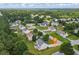 Aerial view of a charming neighborhood featuring well-maintained homes and lush green landscapes at 185 Fox Run, Loganville, GA 30052