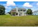Spacious backyard with a two-story deck, patio, and lush green lawn for outdoor enjoyment at 185 Fox Run, Loganville, GA 30052