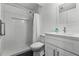Modern bathroom showcasing a tiled shower and vanity with a white sink at 185 Fox Run, Loganville, GA 30052