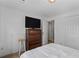 Bedroom with a bed, stool, dresser, and tv at 185 Fox Run, Loganville, GA 30052
