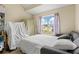 Bedroom featuring a bed, window, and a view to the houses across the street at 185 Fox Run, Loganville, GA 30052