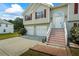 Inviting home exterior with a two-car garage and a welcoming front porch at 185 Fox Run, Loganville, GA 30052