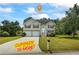 Charming two-story home with a well-manicured lawn and a spacious driveway at 185 Fox Run, Loganville, GA 30052