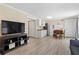 Open-concept living area with a kitchen and stylish decor at 185 Fox Run, Loganville, GA 30052