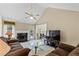 Bright and airy living room adjacent to dining area with vaulted ceilings at 185 Fox Run, Loganville, GA 30052