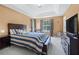 Spacious main bedroom with tray ceilings and en-suite bath at 185 Fox Run, Loganville, GA 30052