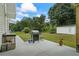 Cozy outdoor patio with a grill and sink, perfect for outdoor cooking and entertaining in the backyard at 185 Fox Run, Loganville, GA 30052
