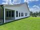Exterior of home showing a covered patio and lush green backyard at 301 Brooke View Trail, Canton, GA 30115