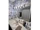 Bright bathroom with a long vanity and a mirror illuminated by a light bar at 1106 Shiloh Nw Ln, Kennesaw, GA 30144