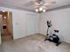 Bedroom features an exercise bike and a double door closet at 1106 Shiloh Nw Ln, Kennesaw, GA 30144