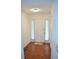 Inviting entryway with hardwood floors, a white door, and sheer curtains adding elegance and privacy at 1106 Shiloh Nw Ln, Kennesaw, GA 30144