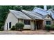 Charming home featuring a mix of siding and brick, complemented by lush landscaping and a welcoming entrance at 1106 Shiloh Nw Ln, Kennesaw, GA 30144