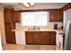 Practical kitchen featuring ample countertop space, wooden cabinets, and a window that provides natural light at 1106 Shiloh Nw Ln, Kennesaw, GA 30144