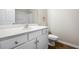 Well-lit bathroom features a white vanity and shower with a bathtub at 122 Creighton Ln, Marietta, GA 30008