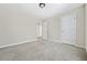 Bedroom with neutral walls, neutral carpet, and doors to other rooms at 122 Creighton Ln, Marietta, GA 30008