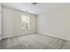 Bedroom with neutral walls, neutral carpet, and a bright window at 122 Creighton Ln, Marietta, GA 30008
