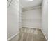 Walk-in closet featuring white wire shelving and neutral carpet at 122 Creighton Ln, Marietta, GA 30008