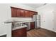Well-equipped kitchen with wood cabinets, stainless steel appliances, and modern finishes at 122 Creighton Ln, Marietta, GA 30008