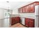Cozy kitchen featuring wood cabinets, stainless steel appliances, and an open layout at 122 Creighton Ln, Marietta, GA 30008
