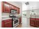 Modern kitchen with stainless steel appliances, a range, and plenty of cabinet space at 122 Creighton Ln, Marietta, GA 30008
