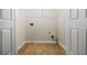 Functional laundry room with tile flooring, washer and dryer hookups, and wire shelving at 122 Creighton Ln, Marietta, GA 30008