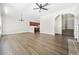 Spacious living room with hardwood floors, fireplace, staircase and ample natural light at 122 Creighton Ln, Marietta, GA 30008