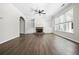 Bright living room with hardwood floors, a brick fireplace, and built-in bookshelves at 122 Creighton Ln, Marietta, GA 30008