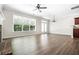 Open-concept living area features hardwood floors, large windows, and view to the yard at 122 Creighton Ln, Marietta, GA 30008