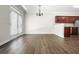 Bright living area with hardwood floors, view to the kitchen and access to the backyard at 122 Creighton Ln, Marietta, GA 30008
