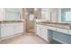 Bright bathroom features granite countertops, white cabinets, and glass-enclosed shower at 3272 Monarch Pine Dr, Peachtree Corners, GA 30071