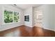 Bedroom features hardwood floors, fireplace, and ensuite bathroom at 3272 Monarch Pine Dr, Peachtree Corners, GA 30071