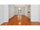 Elegant dining room with hardwood floors, a chandelier, and views to the outdoor patio at 3272 Monarch Pine Dr, Peachtree Corners, GA 30071