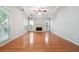 Spacious living room with hardwood floors, fireplace, and large windows at 3272 Monarch Pine Dr, Peachtree Corners, GA 30071