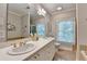 Elegant bathroom with double sinks, modern fixtures, and tiled floors at 5415 Northland Ne Dr # 303, Atlanta, GA 30342