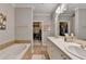 Elegant bathroom features double sinks, bathtub, closet, and ample counter space at 5415 Northland Ne Dr # 303, Atlanta, GA 30342