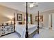 Inviting bedroom featuring a four-poster bed, neutral walls, and dresser at 5415 Northland Ne Dr # 303, Atlanta, GA 30342