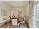 Charming dining room features wood floors, chandelier, and access to the balcony at 5415 Northland Ne Dr # 303, Atlanta, GA 30342