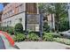 Exterior shot of The Regent Condominium building with signage at 5415 Northland Ne Dr # 303, Atlanta, GA 30342