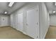 Hallway features a row of identical white doors, each leading to a different room at 5415 Northland Ne Dr # 303, Atlanta, GA 30342