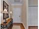 Hallway with hardwood floors, a decorative table and a closet with double doors at 5415 Northland Ne Dr # 303, Atlanta, GA 30342