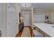 Hallway with hardwood floors, a decorative table, and white closets near the kitchen at 5415 Northland Ne Dr # 303, Atlanta, GA 30342