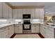 Updated kitchen featuring stainless steel appliances and white cabinets at 5415 Northland Ne Dr # 303, Atlanta, GA 30342