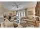 Spacious living room opens to dining and balcony with ceiling fan and hardwood floors at 5415 Northland Ne Dr # 303, Atlanta, GA 30342