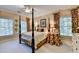 Serene main bedroom with a four-poster bed, white carpet, and natural light at 5415 Northland Ne Dr # 303, Atlanta, GA 30342