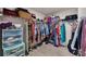Organized walk-in closet with ample storage for clothes, shoes, and accessories at 738 Woodstock Grove Dr, Woodstock, GA 30188