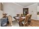 Traditional dining room with a wooden table and chairs, hardwood floors and a vintage display cabinet at 738 Woodstock Grove Dr, Woodstock, GA 30188