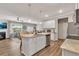Beautiful kitchen with granite countertops, stainless steel appliances, and a view into the living room at 738 Woodstock Grove Dr, Woodstock, GA 30188